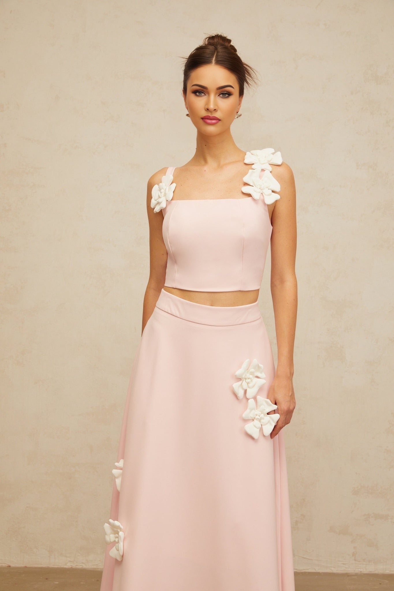 Two piece pink outfit with floral applique details matching top and skirt set