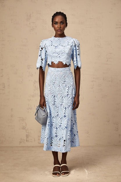 Two piece womens outfit featuring a blue guipure lace top and matching skirt in Audrey style