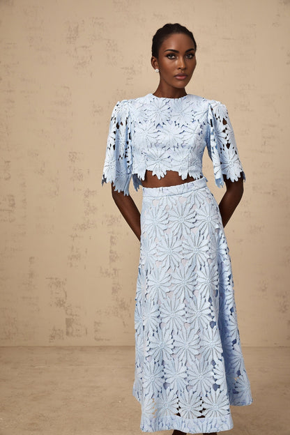 Two piece womens outfit with blue lace top and matching skirt in Audrey style