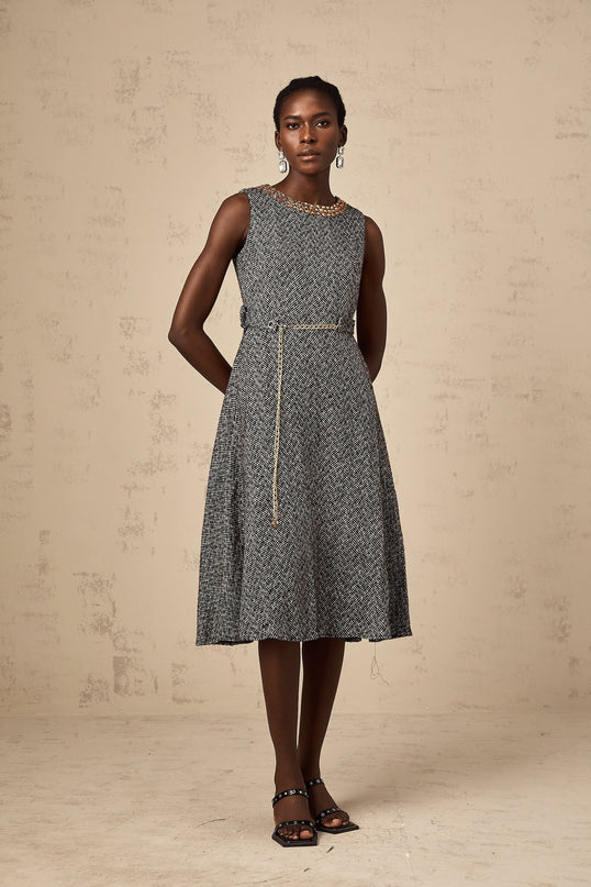 Valentine grey crystal sleeveless tweed midi dress on a mannequin against a plain background