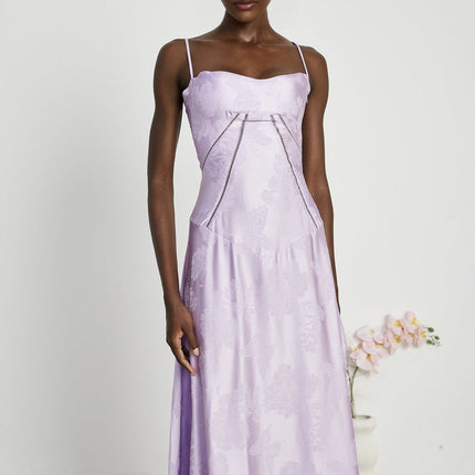 Valerie Purple Seraphina Jacquard Maxi Dress Spaghetti Straps Low-Cut Neckline Jacquard Fabric Side Zip Fastening Rear Tie Fastening Maxi Length Design Sizes Available Effortless Glamour