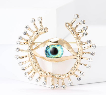 Van Hoef brooch Gold Devil's Eye motif glimmering accents intricate detailing versatile fit feel office look evening wear bold personality