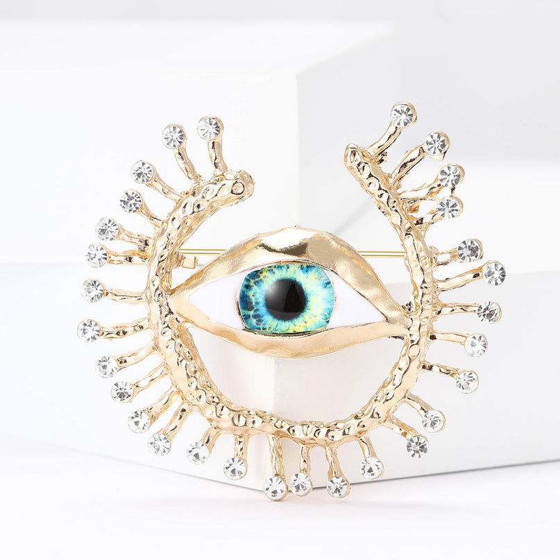 Van Hoef brooch Gold Devil's Eye motif glimmering accents intricate detailing versatile fit feel office look evening wear bold personality