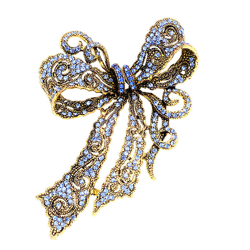 Van Hoef gold rhinestone bow brooch