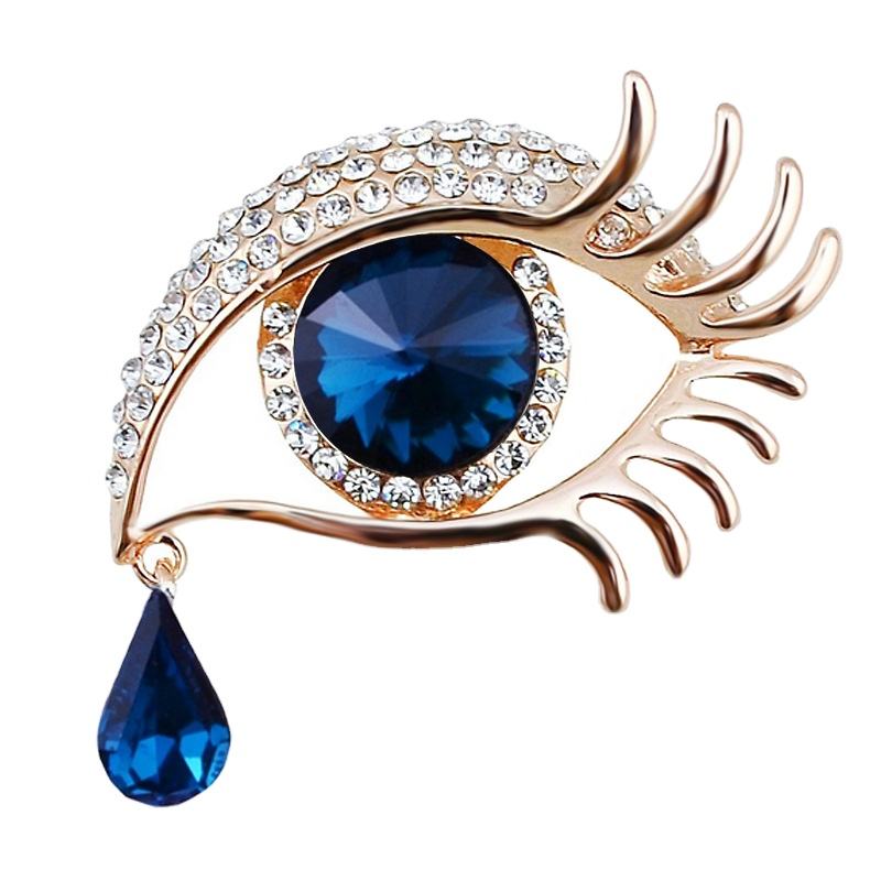 Van Hoef gold rhinestone brooch with deep blue crystal and teardrop element