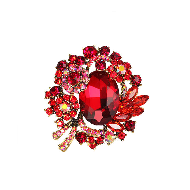 Van Hoef vintage brooch with red gemstones and crystals in intricate design