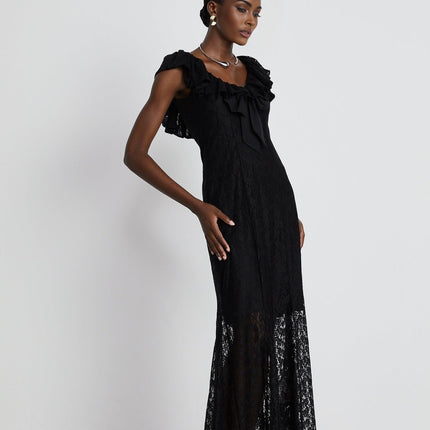 Virginia Black Chantilly Lace Gown Bow Trim Slip Dress Model 5'10 Size M V-Neckline Ruffled Trim Semi-Sheer Detachable Slip Dress Rear Hook Zip Fastening 50% Polyester 50% Viscose