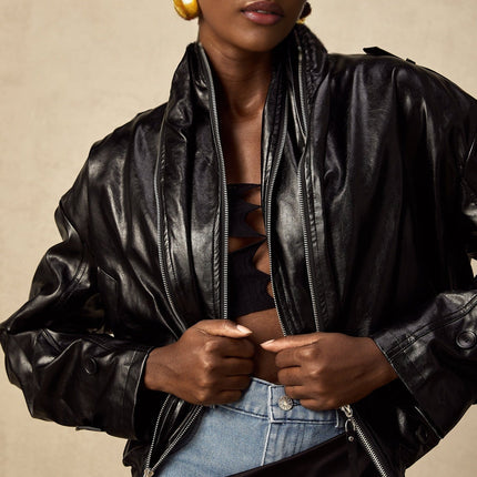 Virginie Black Faux Leather Jacket with Quilted Surface and Puffball Hem