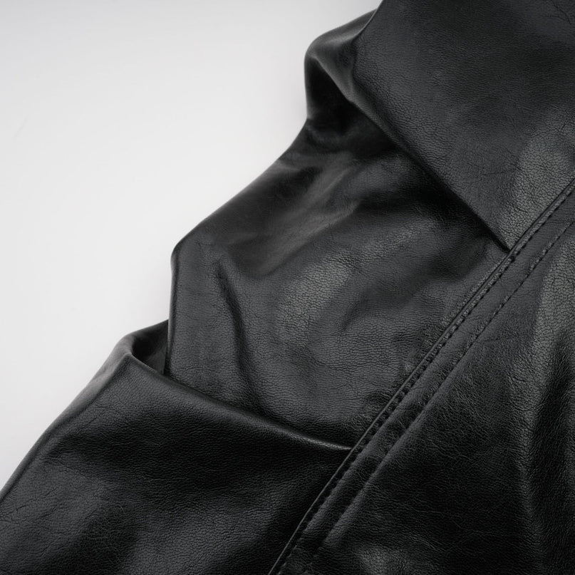 Virginie Black Faux Leather Jacket with Quilted Texture and Puffball Hem