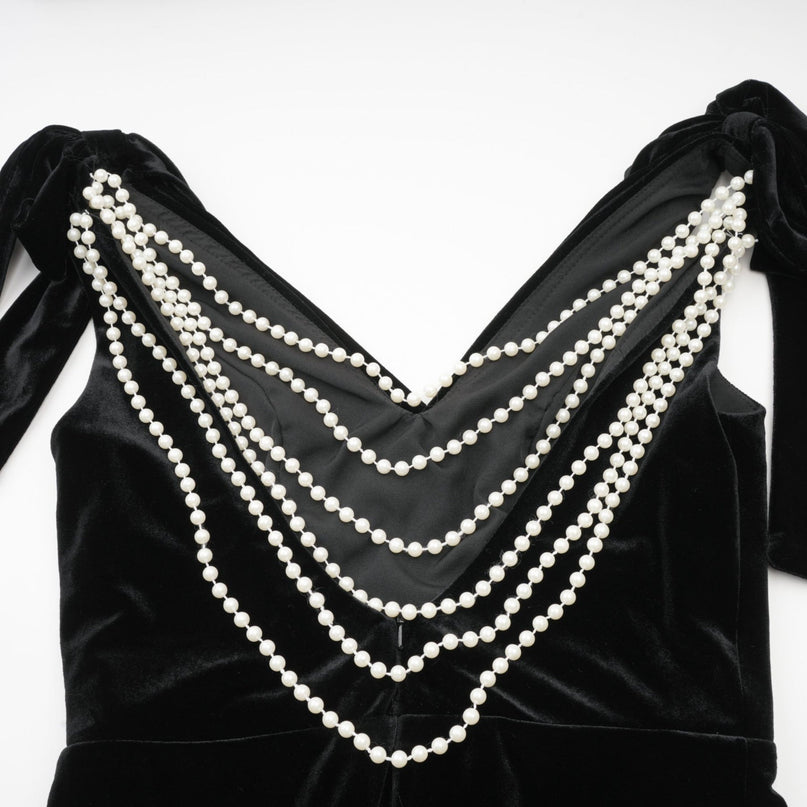 Vittoria Black Velvet Maxi Dress with Cowl Neck and Open Back Bow detail adorned with Faux-Pearls Train Design and Rear Zip Fastening