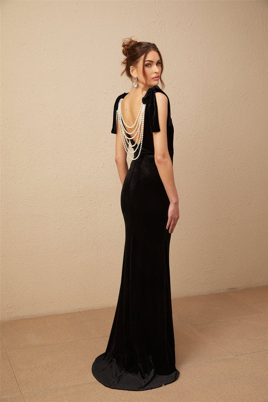 Vittoria Black Velvet Maxi Dress with Cowl Neck and Open Back Bow detail adorned with Faux-Pearls