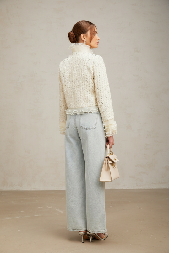 A cropped white jacket with beaded embellishments and ruffle details named Blanche | Hair Updated