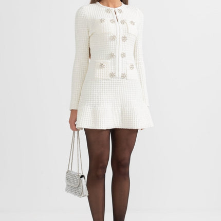 White A-line silhouette dress with textured fabric and button detailing
