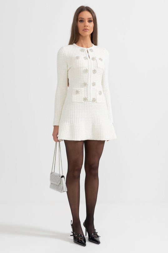 White A-line silhouette dress with textured fabric and button detailing