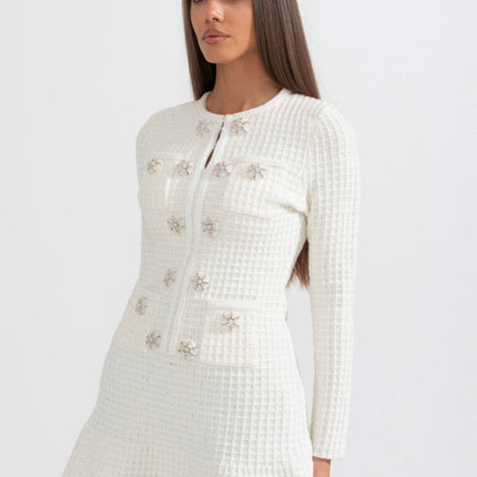 White A-line silhouette dress with textured fabric and button detailing