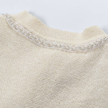 White A-line silhouette with fitted bodice button-down pleated skirt lightweight knitted fabric embellished buttons pockets formal events