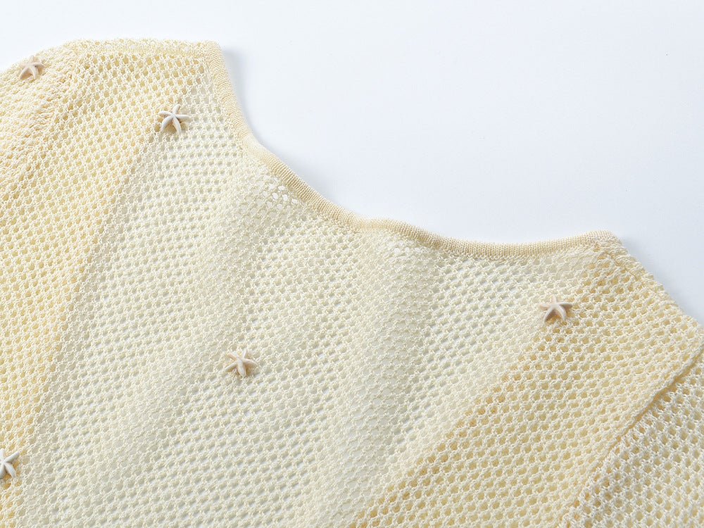 White body-hugging knit top with circular accent at bust