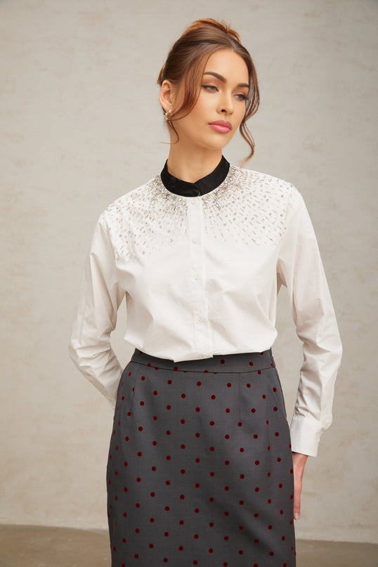 White buttonup shirt adorned with crystal embellishments featuring a collar and long sleeves