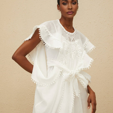 White cotton maxi dress with floral embroidery and cap sleeves