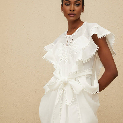 White cotton maxi dress with floral embroidery and cut-out detailing