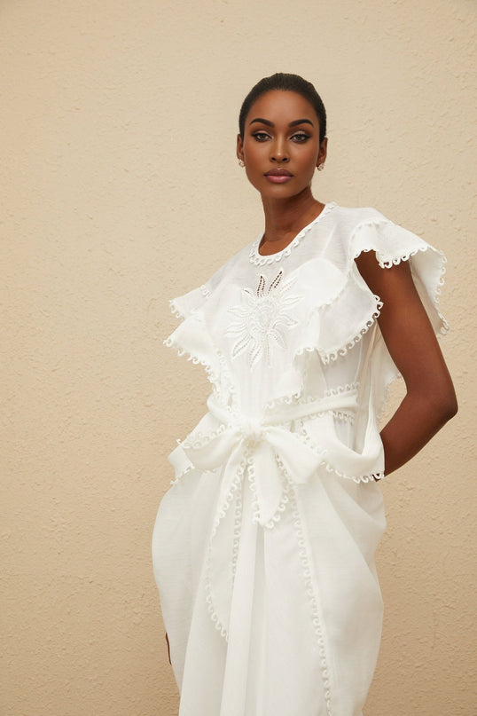 White cotton maxi dress with floral embroidery and cut-out detailing