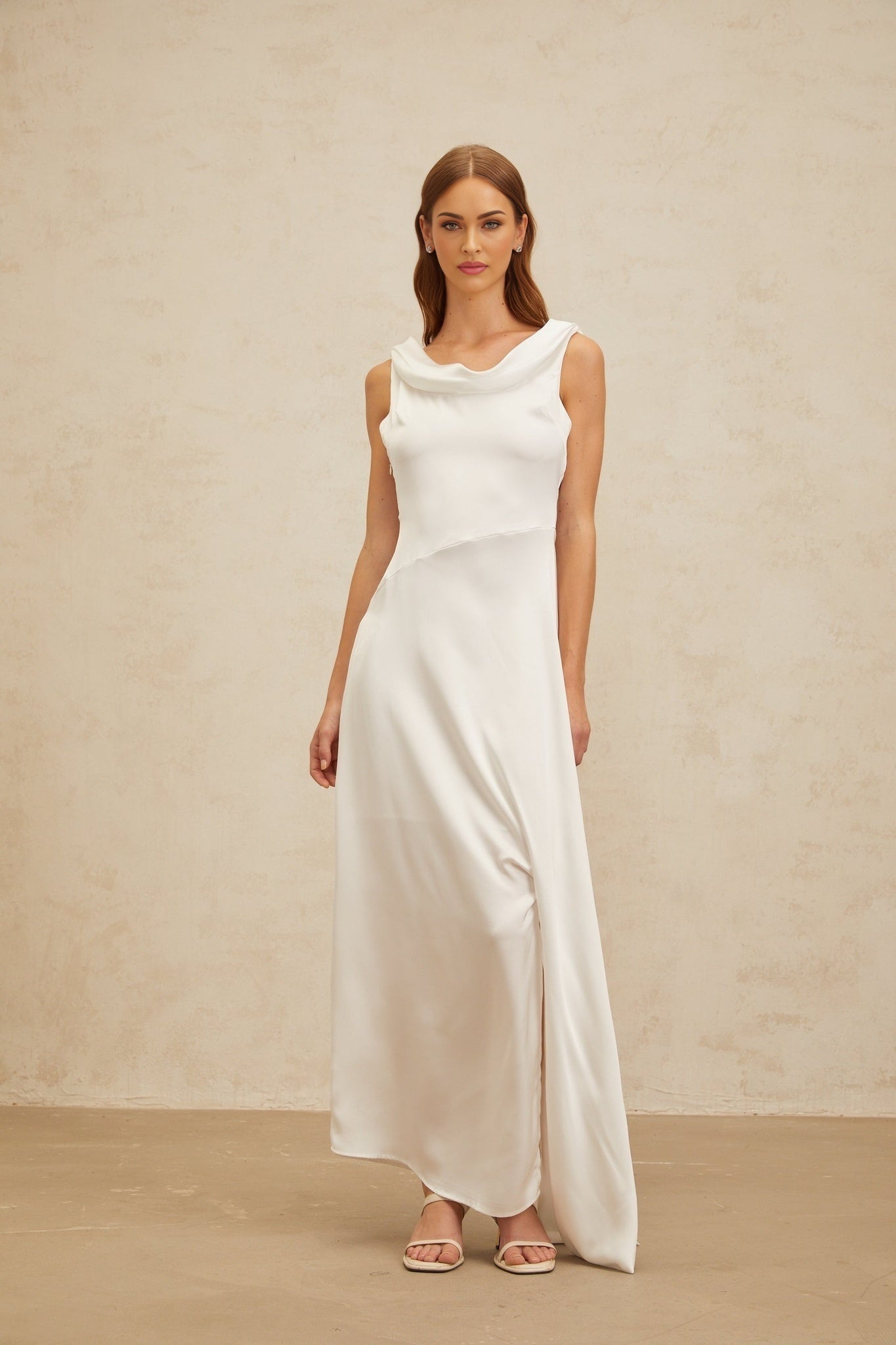 White cowl neck sleeveless maxi dress with twist detailing and satin finish