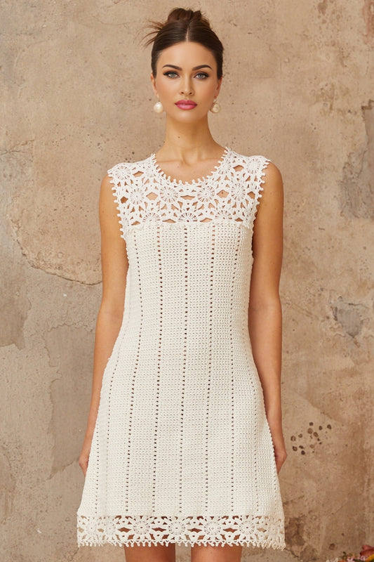 White crochet knit mini dress with floral applique details named Gisele