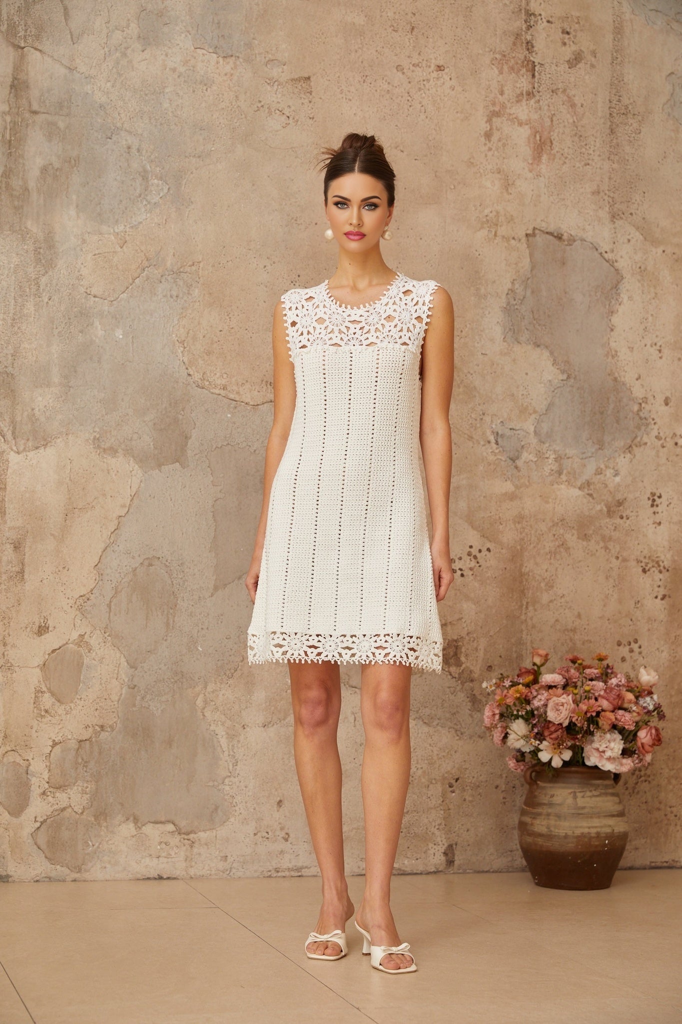 White crochet knit mini dress with floral applique details named Gisele