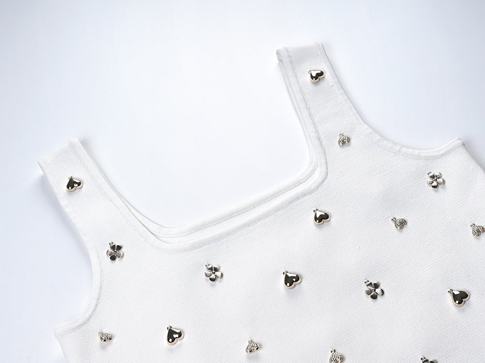 White cropped top with flared skirt embellished with floral motifs