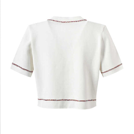 White cropped top and high-waisted skirt with contrast trim and pockets