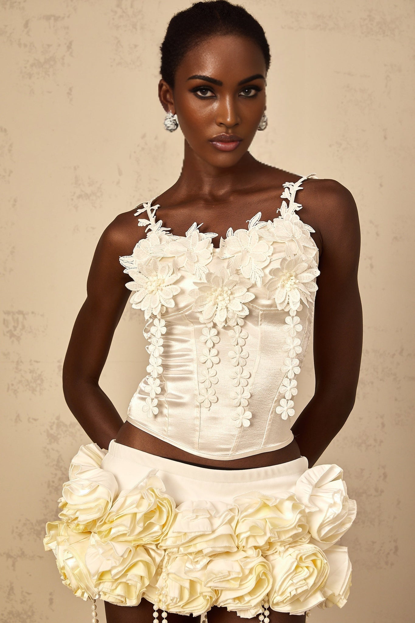White cropped top with floral embroidery design named Melina