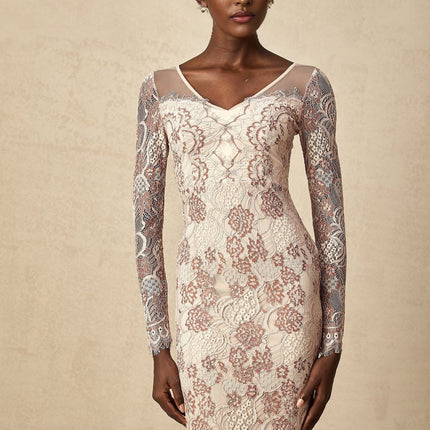 White fitted midi dress with intricate guipure lace pattern long sleeves high neckline and scalloped hem