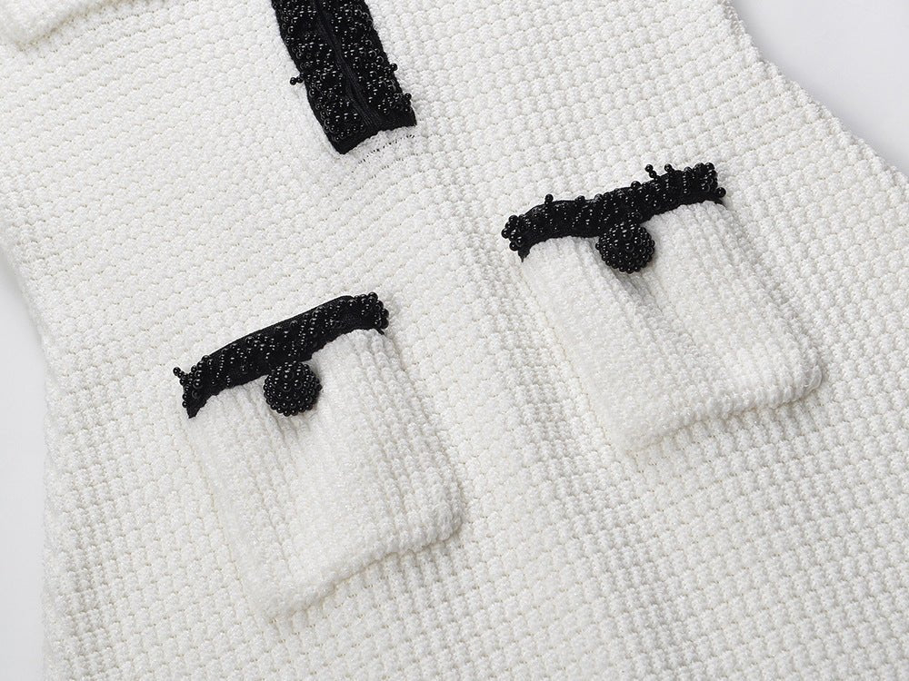 Elegant white fitted silhouette with flared hem and pocket detailing