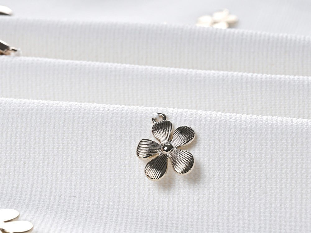 White floral embellished cropped top and flared skirt