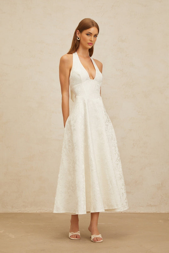 White floral jacquard halterneck dress with open back and self-tie design