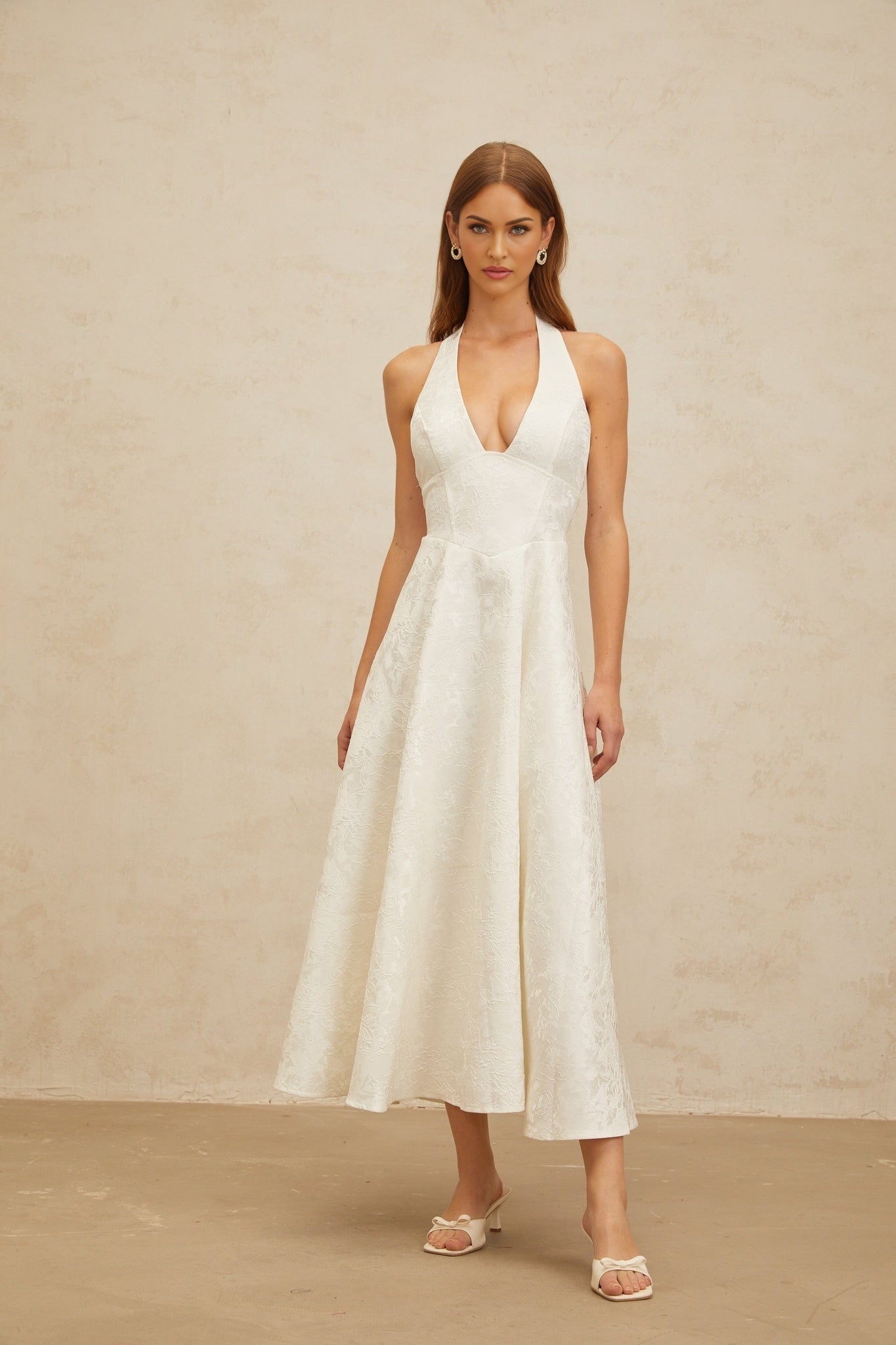 White floral jacquard halterneck midi dress with open back and self-tie design