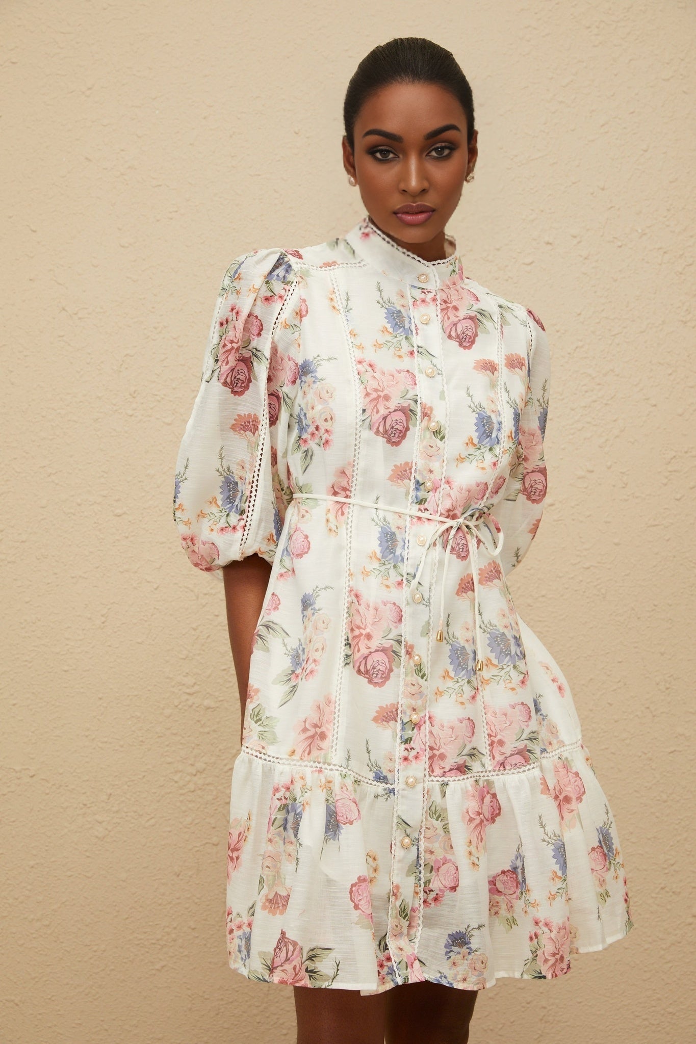 White floral print puff sleeve dress with faux-pearl buttons and tied waist