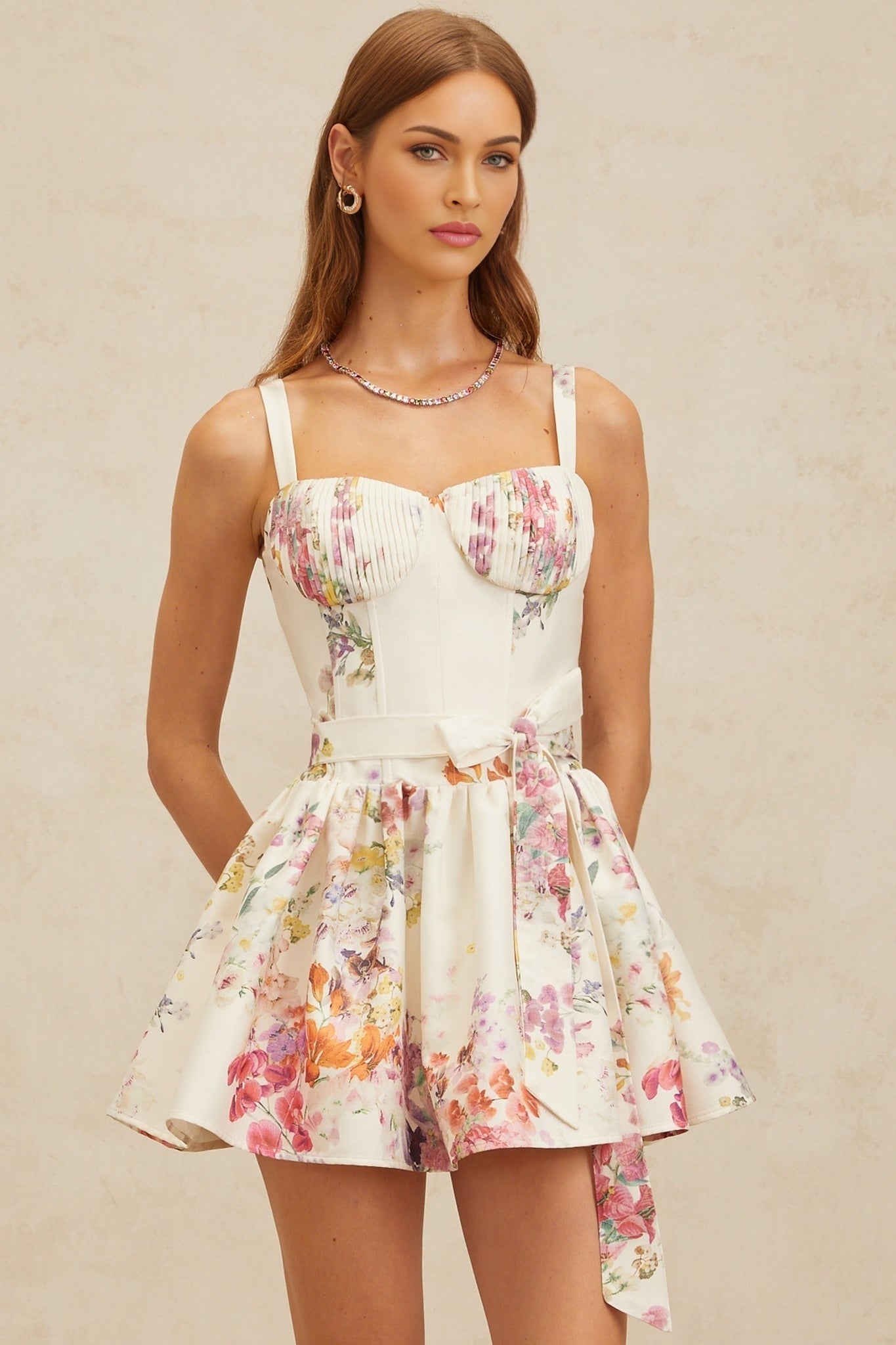 White floral print sweetheart neckline dress with cinched waist and flounce skirt