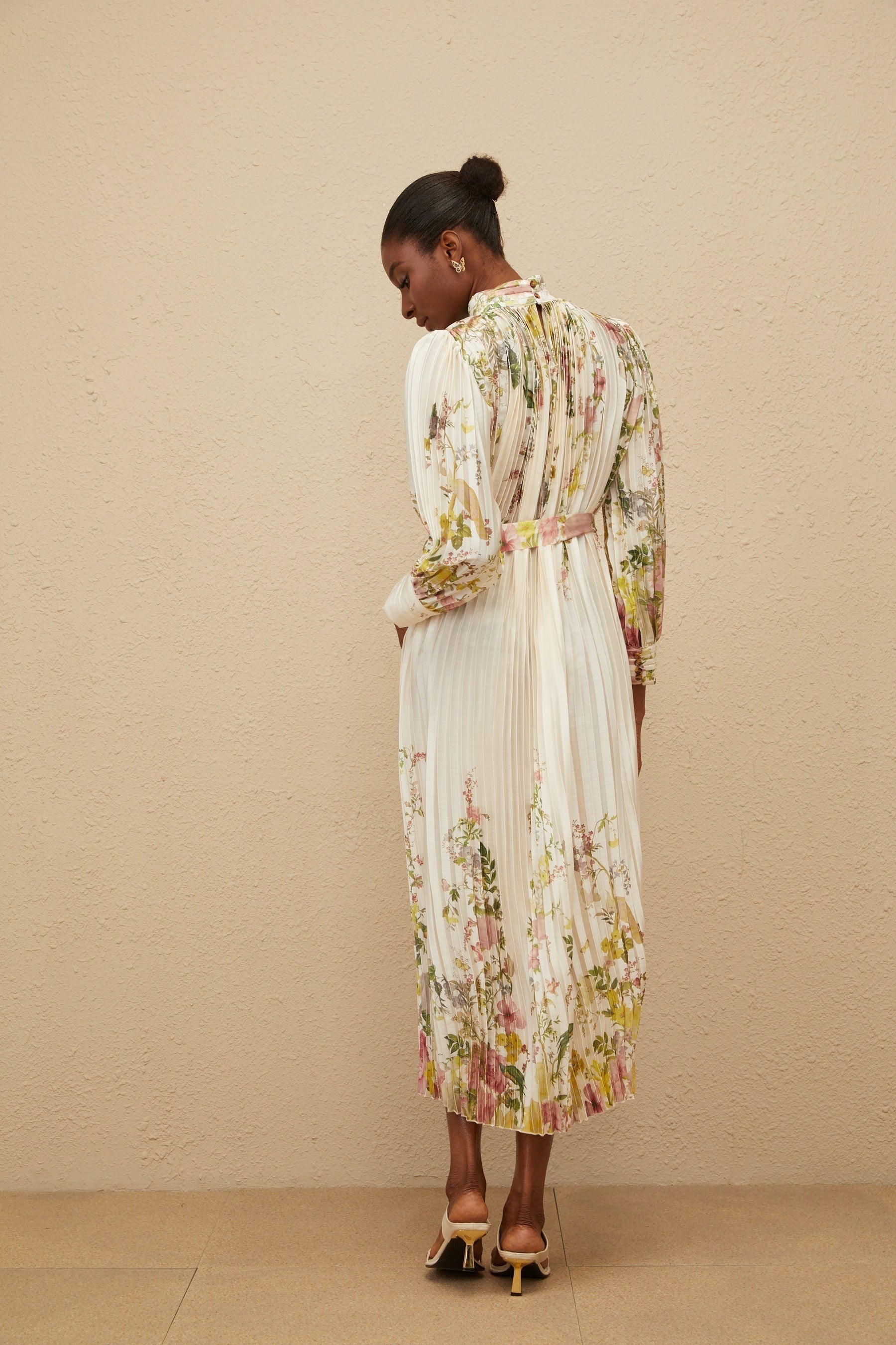 White floral print turtleneck midi dress with cinched waist and pleats