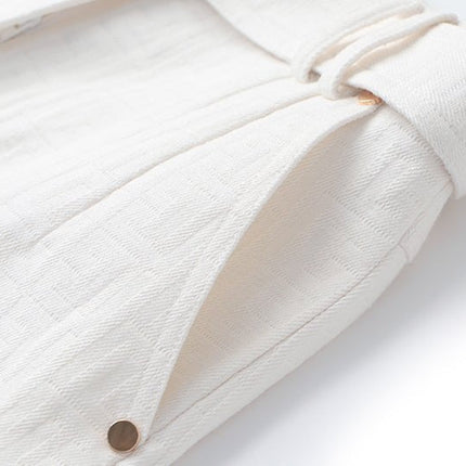 White high-waisted tailored shorts with buckle detail