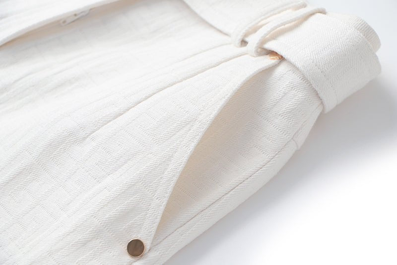 White high-waisted tailored shorts with buckle detail