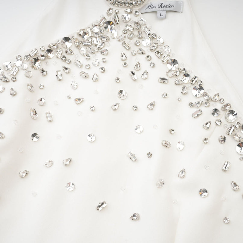 White lace embellished mini dress with floral pattern and short sleeves named Xanthea