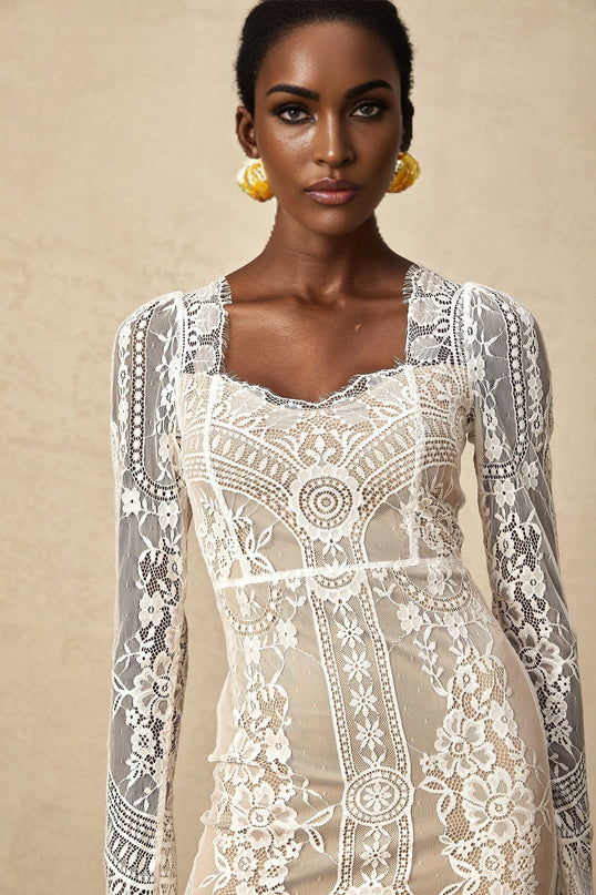 White lace mini dress with scalloped hem and intricate floral pattern