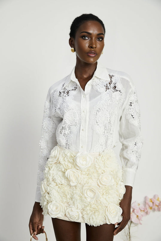 White lace shirt with embroidered details and cut out sections