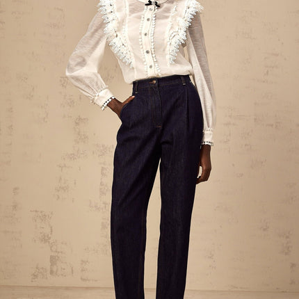 White lace trimmed semi sheer shirt called Capucine on a plain background