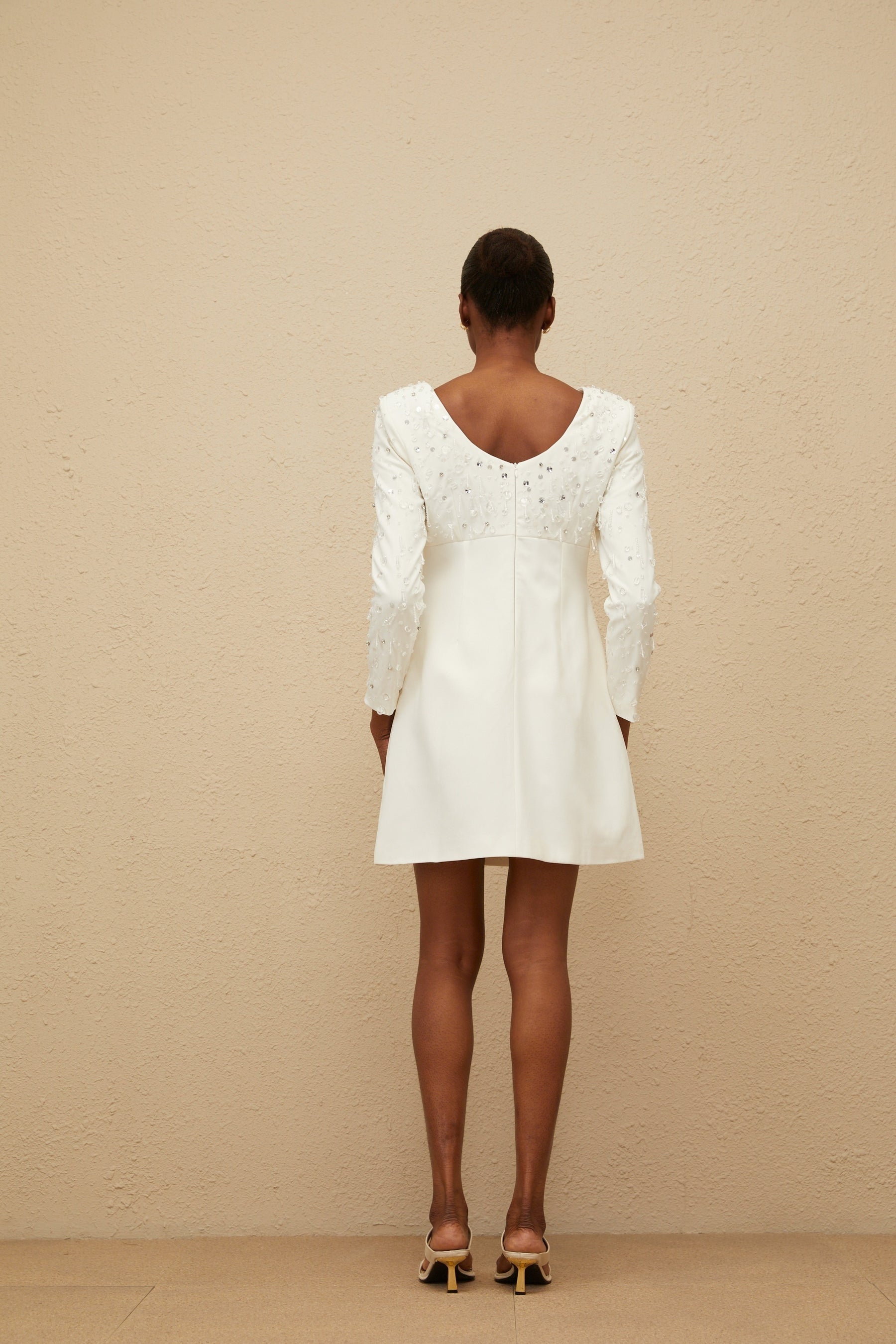 White long sleeve A-line dress with sequin and crystal embellishments