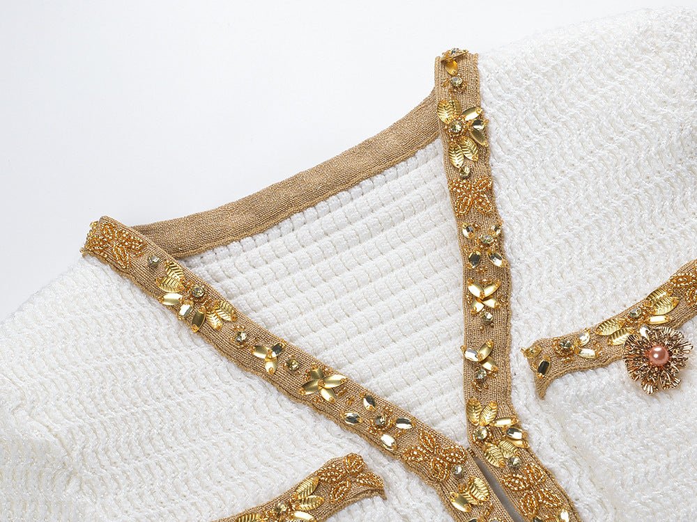 White Long Sleeve Dress with Gold Accents and Flared Hem