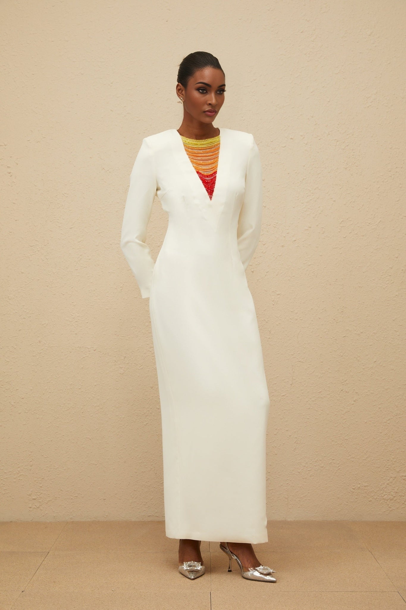 White long sleeve maxi dress with bead and rhinestone embellishments