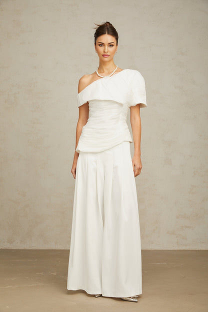 White matching set featuring a creased top and trousers named Adele