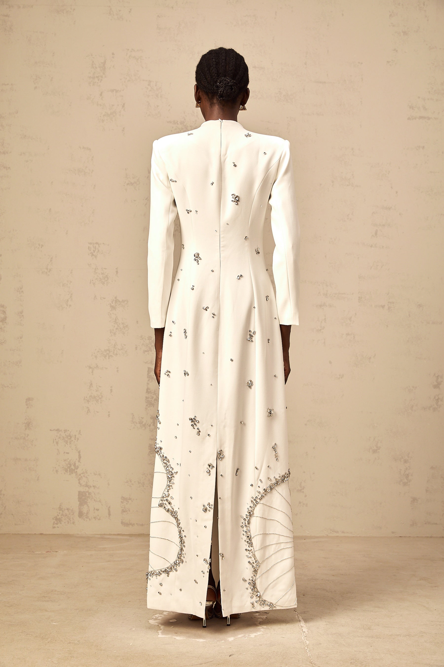 White maxi dress with lotus flower embellishments named Daphne